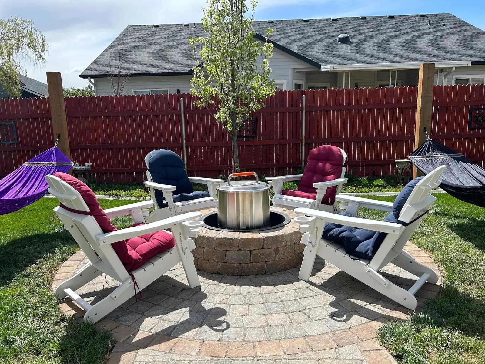 circular paver fire pit patio with adirondack seating outdoor living space