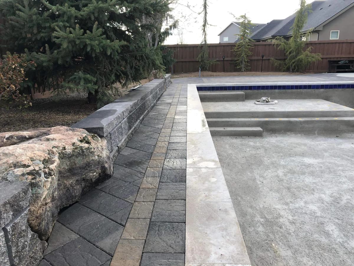 eagle idaho custom pool landscaping with stone edging and retaining wall photo 1