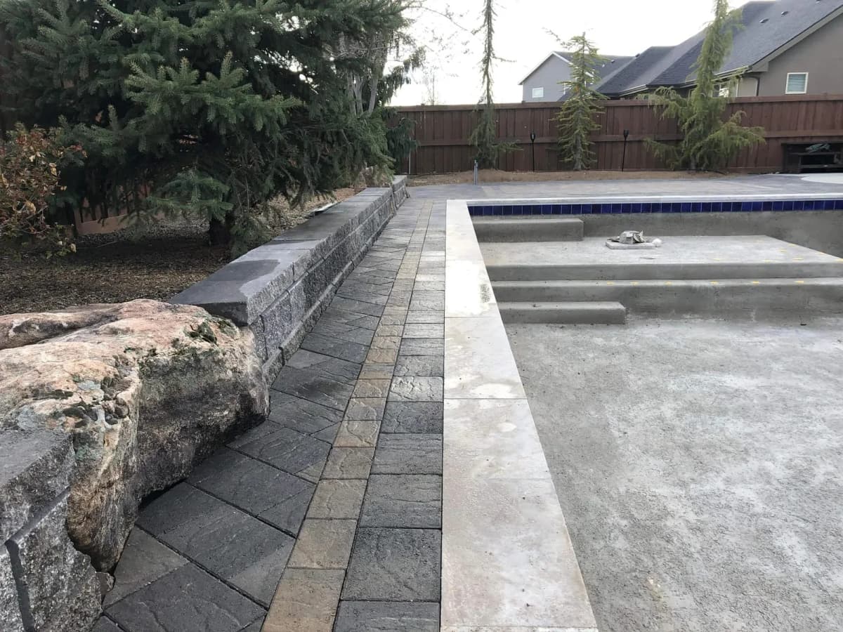 eagle idaho custom pool landscaping with stone edging and retaining wall photo 1