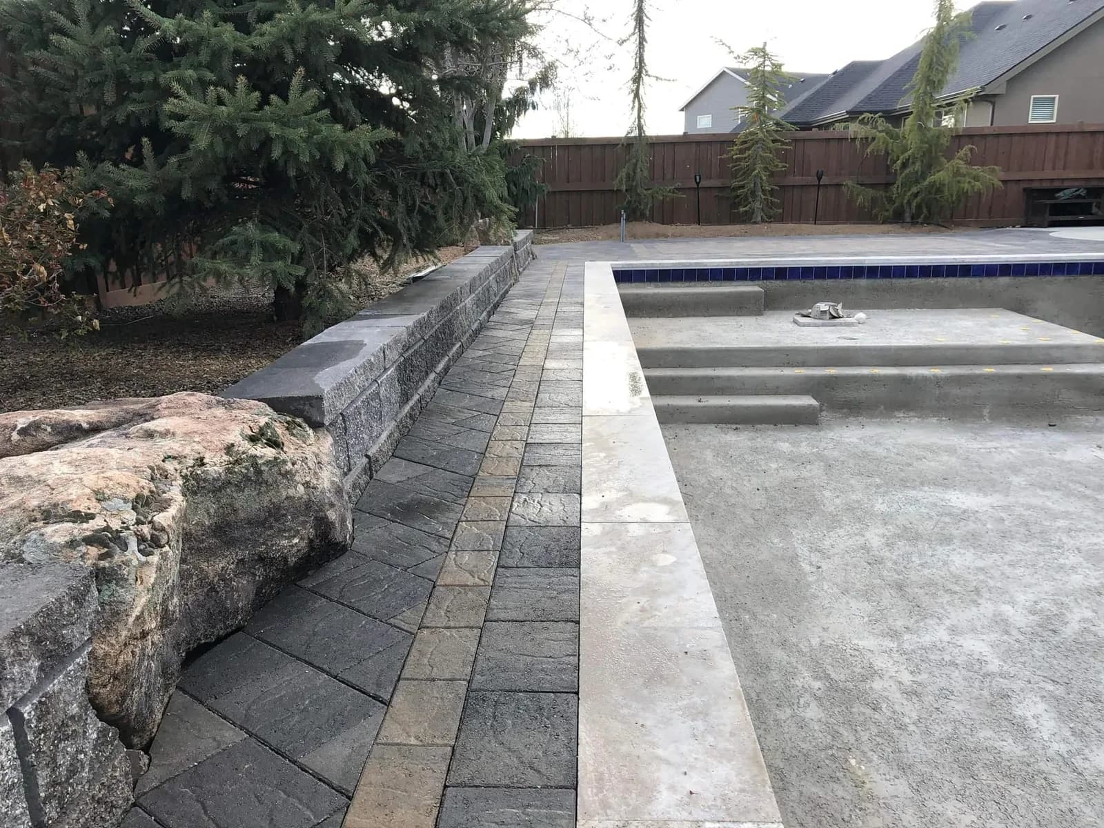 eagle idaho custom pool landscaping with stone edging and retaining wall photo 1