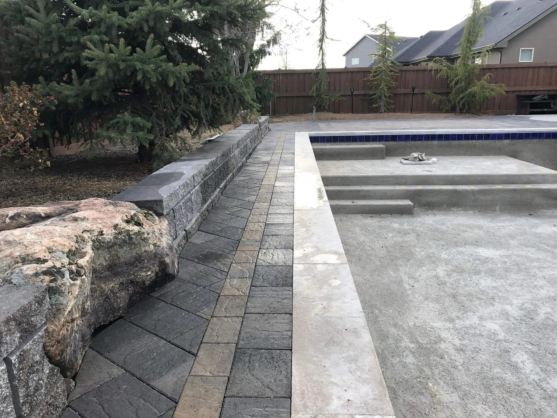 eagle idaho custom pool landscaping with stone edging and retaining wall photo 1