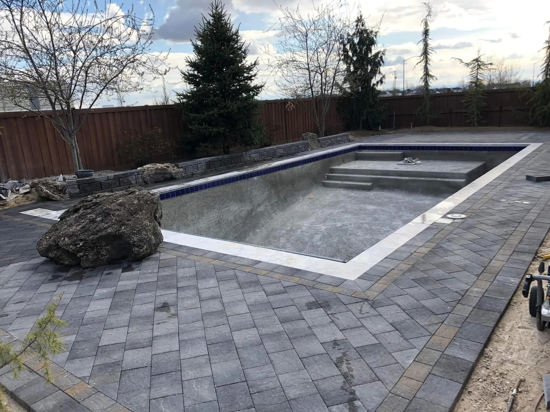 eagle idaho custom pool landscaping with stone edging and retaining wall pool photo 3