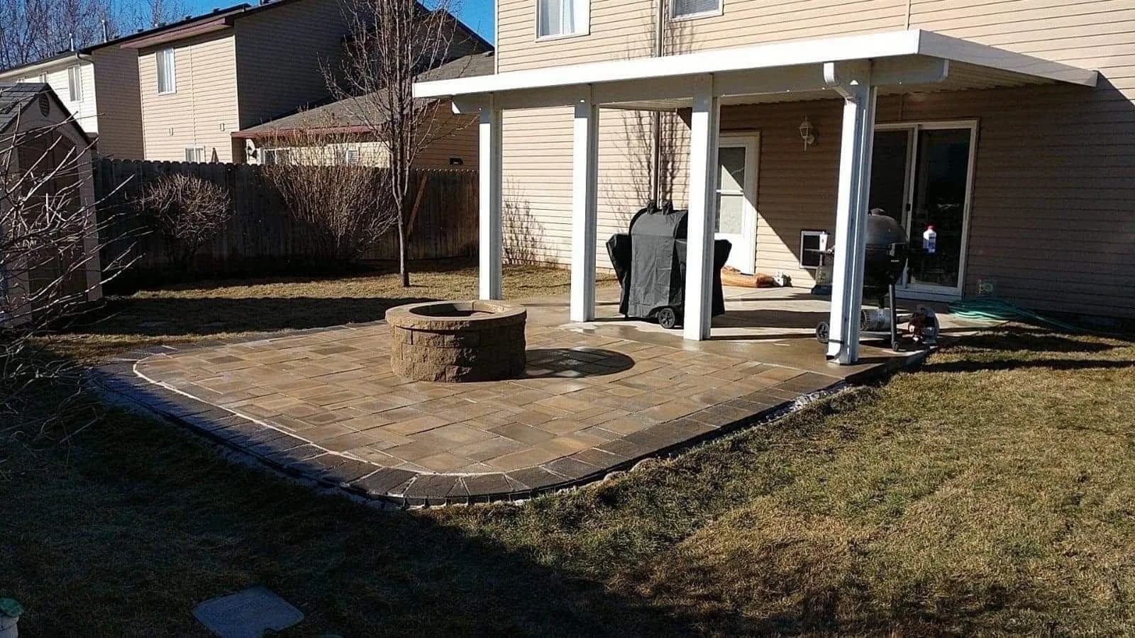 star idaho paver patio with custom raised fire pit photo 1