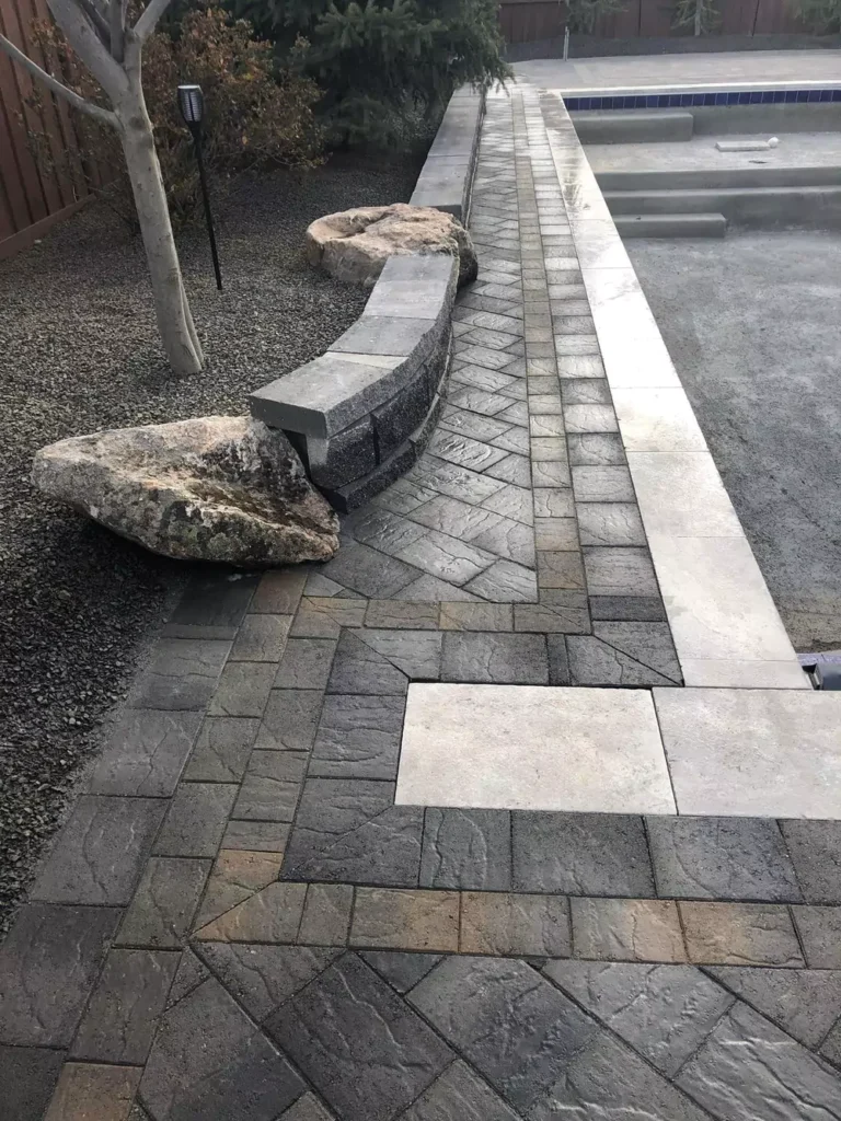 208-specialties-landscaping-hardscaping-project-eagle-idaho-custom-pool-landscaping-with-stone-edging-and-retaining-wall-pool-photo-4-68599d6e30318